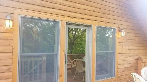 a view of house with a tree
