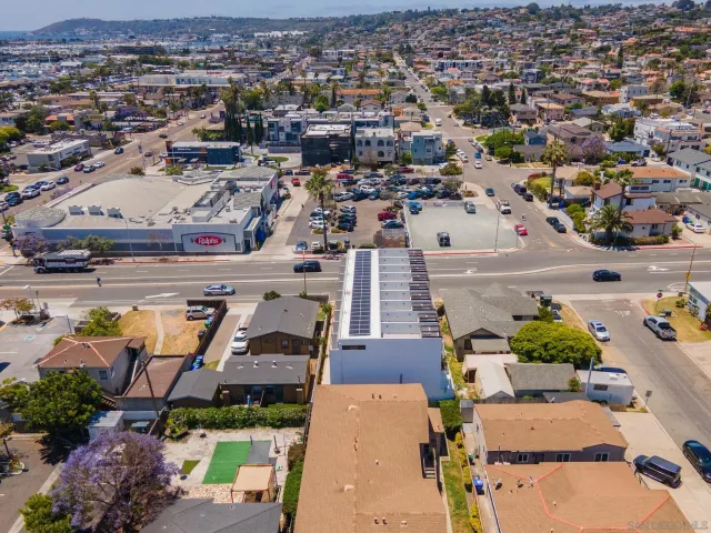an aerial view of a city with lots of residential buildings