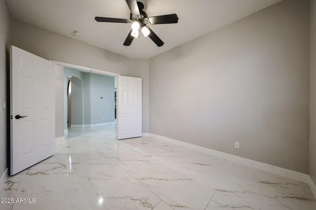a white bath tub sitting next to a shower