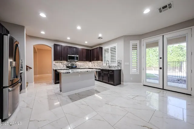 a view of a backyard with pathway