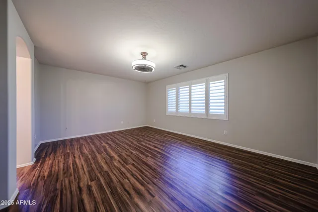a view of a house with backyard and tree