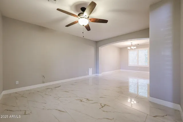 a view of livingroom with furniture fireplace and window