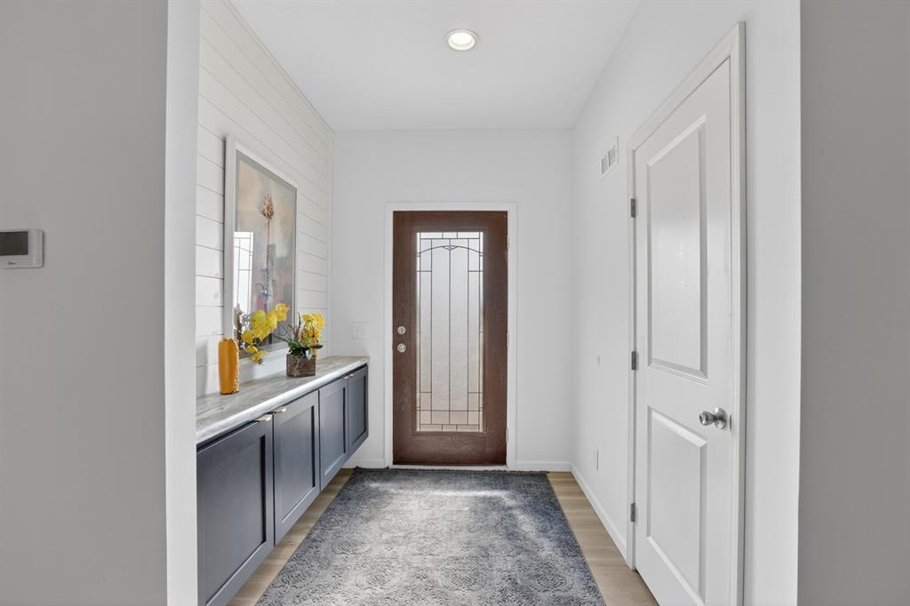 204 Doss Lane Moody, TX 76557 - Photo 10 of 19 a view of a hallway to a livingroom with wooden floor windows