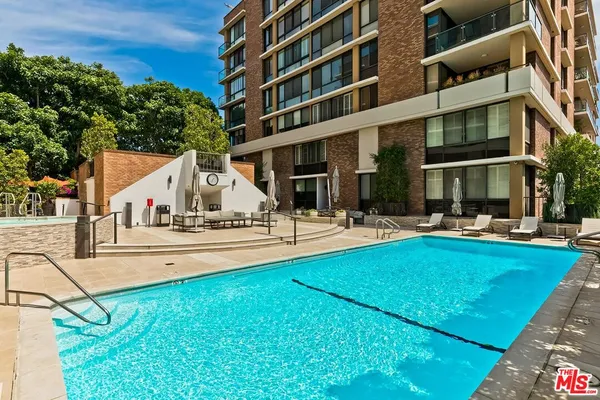 a view of a swimming pool with a patio