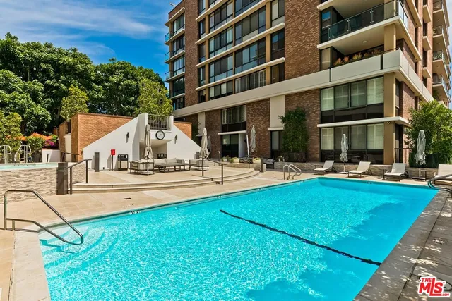 a view of a swimming pool with a patio