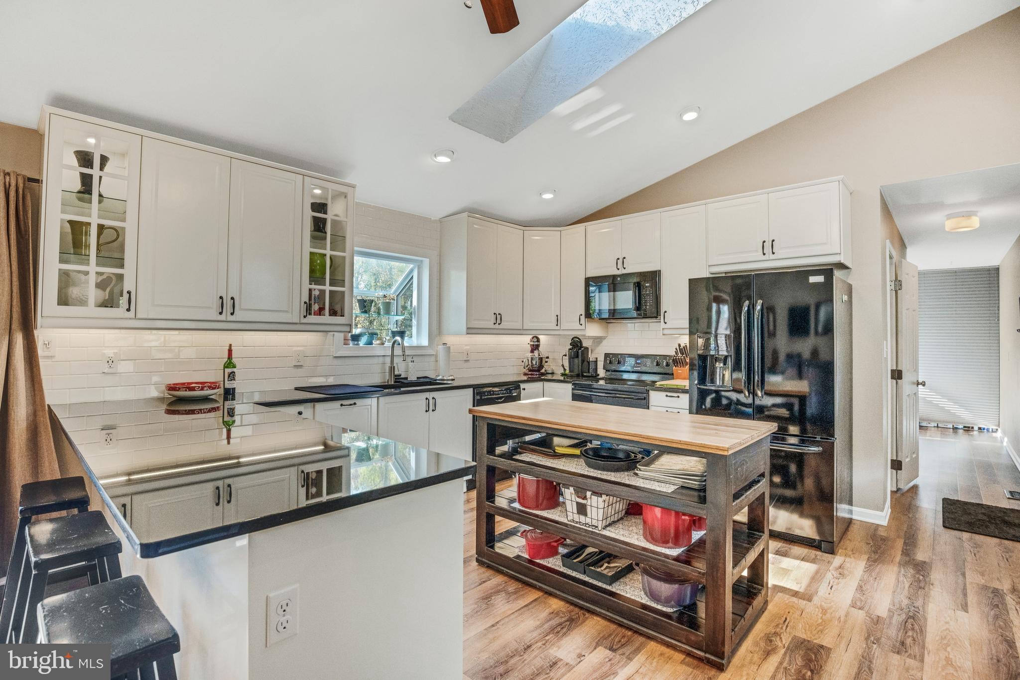 920 Carson Road Huntingtown, MD 20639 - Photo 5 of 32 a large kitchen with stainless steel appliances granite countertop a stove and a sink