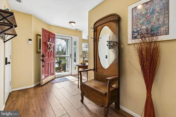 a living room with furniture fireplace and a large window