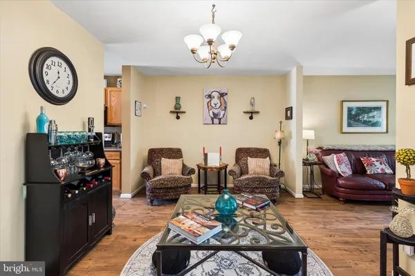 a kitchen with stainless steel appliances granite countertop a refrigerator a sink a stove and island