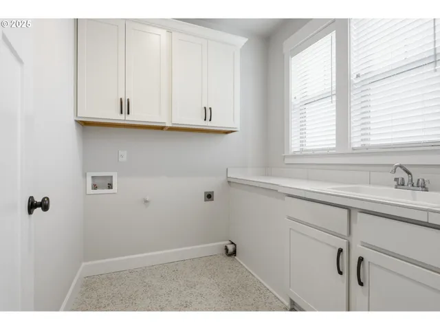a bathroom with a sink and a window