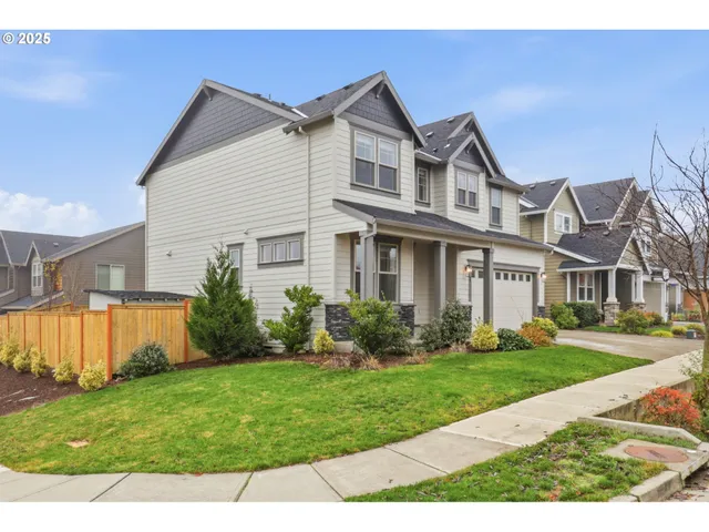 a front view of a house with garden and porch