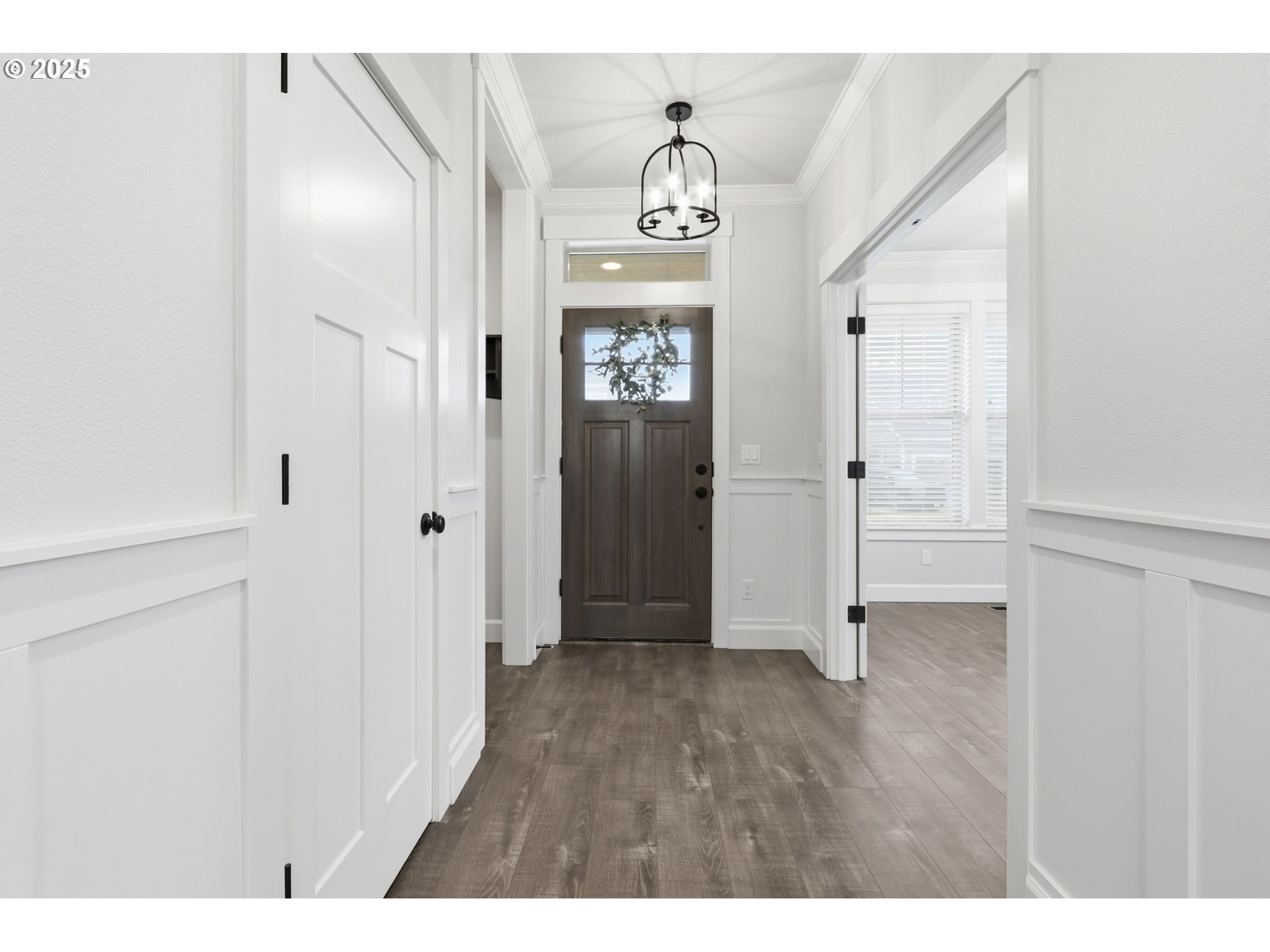11936 Skellenger Way Oregon City, OR 97045 - Photo 3 of 32 a view of a hallway with wooden floor