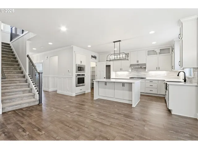 a view of kitchen with wooden floor