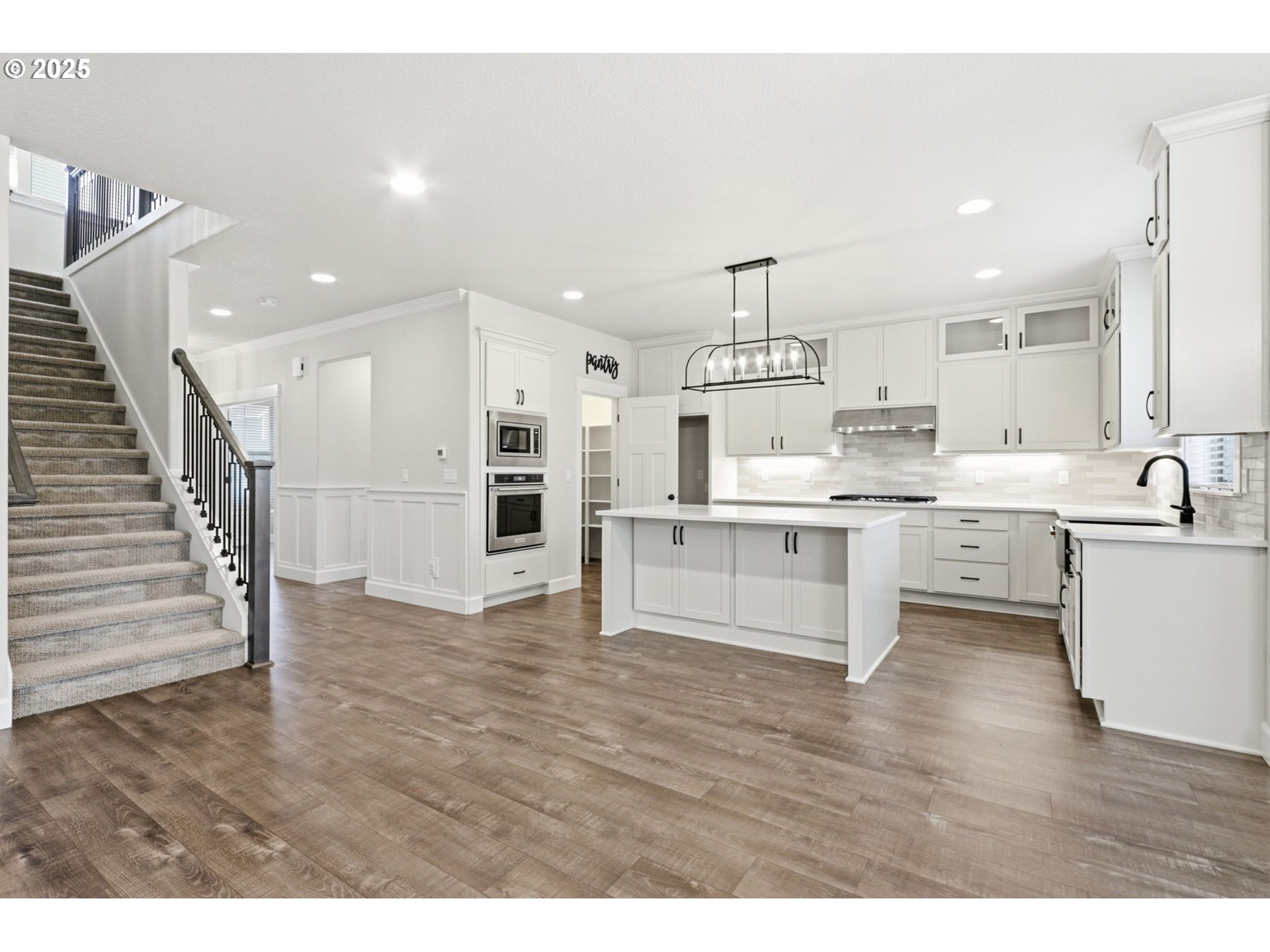 11936 Skellenger Way Oregon City, OR 97045 - Photo 5 of 32 a view of kitchen with wooden floor