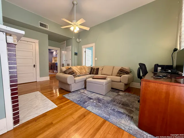 a living room with furniture and a rug