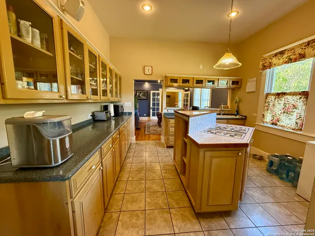 a very nice looking dining room with a large window