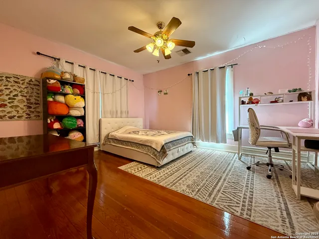 a bedroom with a bed and a table in it