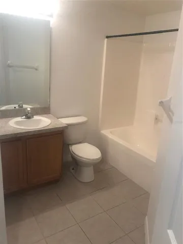 an empty room with a empty space and windows