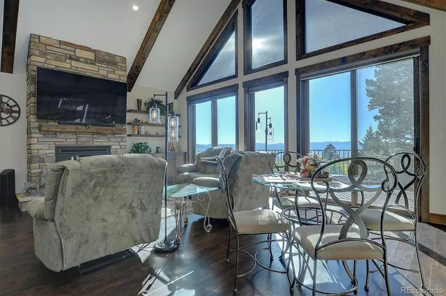 a view of a dining room with furniture window and outside view