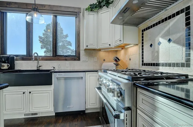 a kitchen with a stove and a sink