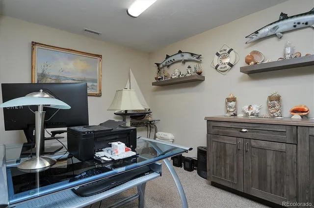 a room with lots of furniture and cabinets