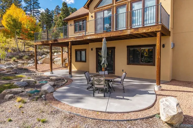 a view of a house with outdoor seating