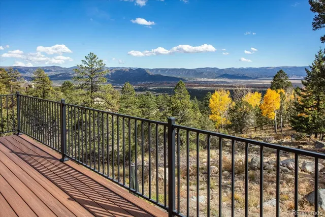 a view of city and mountain from a balcony