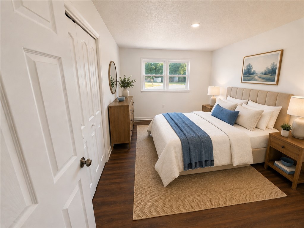 404 McClain Road Anderson, SC 29626 - Photo 18 of 24 This inviting bedroom features rich hardwood flooring and bright windows.
