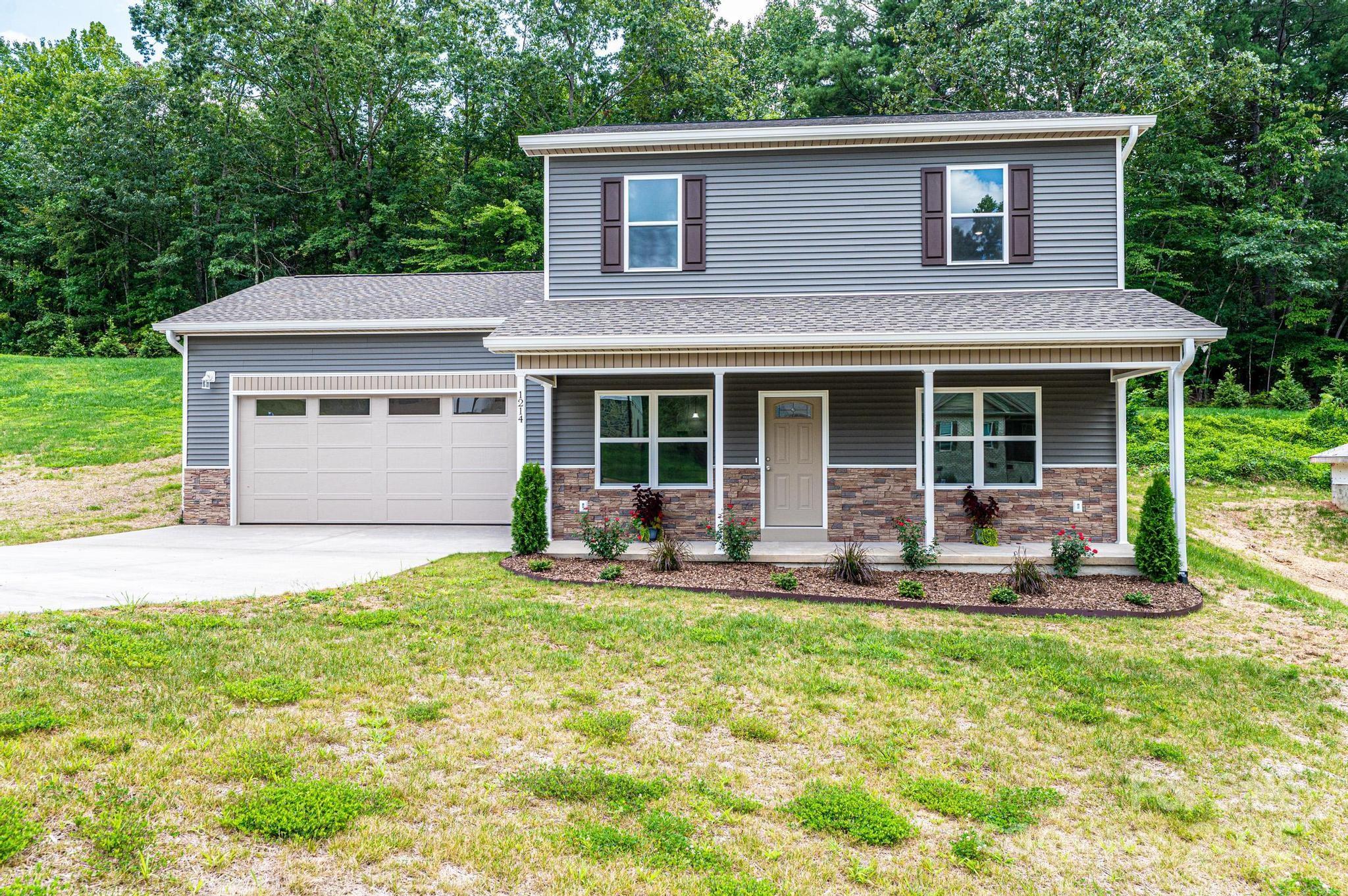 1214 Winter Place Lenoir, NC 28645 - Photo 1 of 19 a house view with a garden space