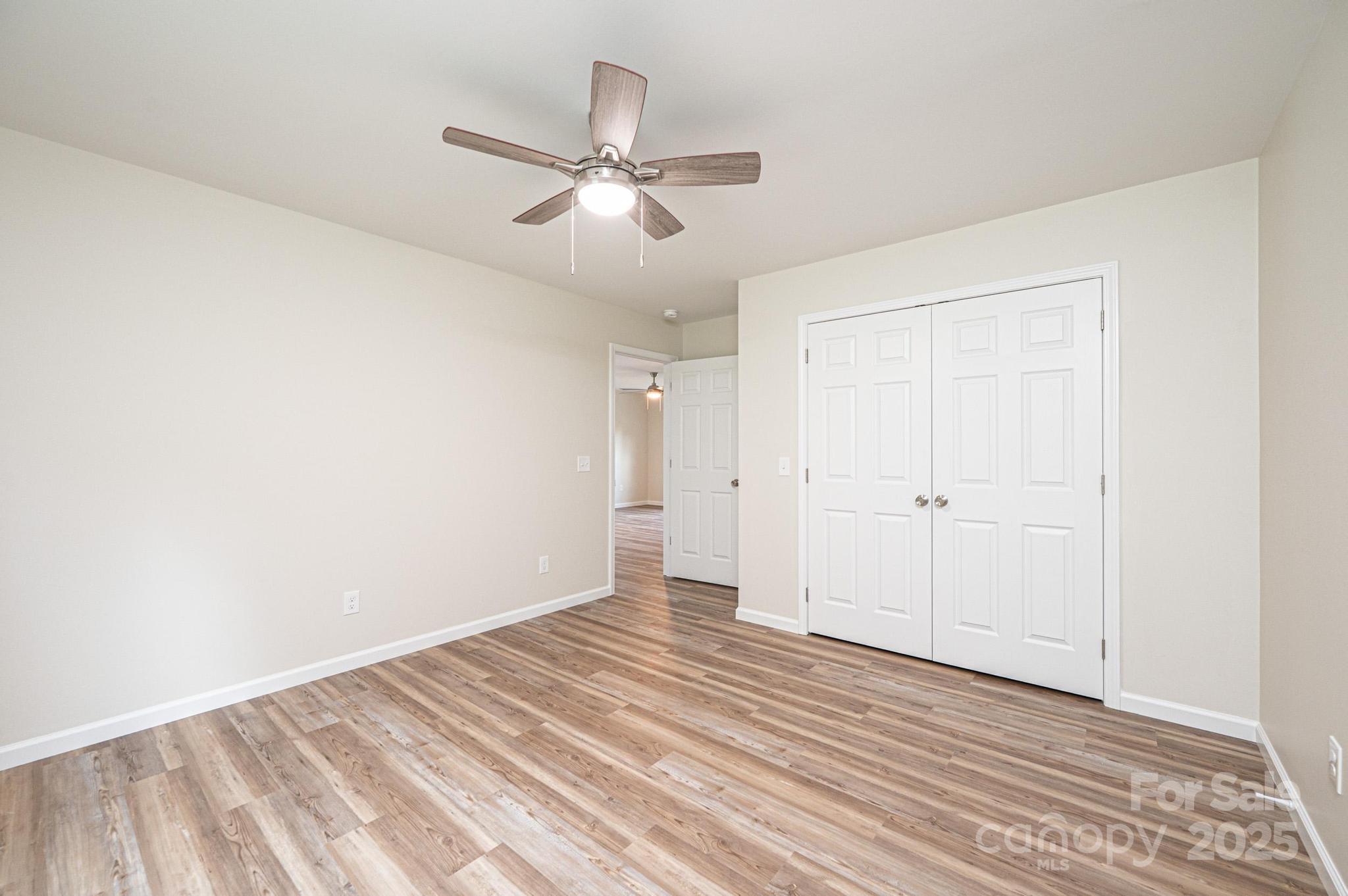 1214 Winter Place Lenoir, NC 28645 - Photo 15 of 19 a view of a room with wooden floor closet and windows
