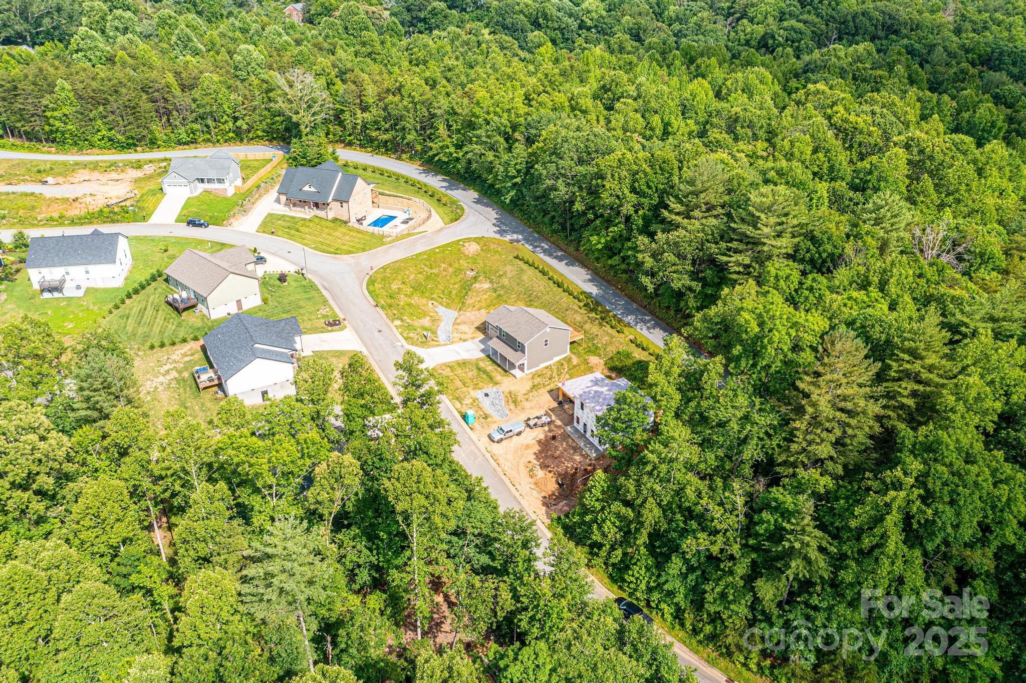 1214 Winter Place Lenoir, NC 28645 - Photo 19 of 19 a view of a swimming pool with a yard