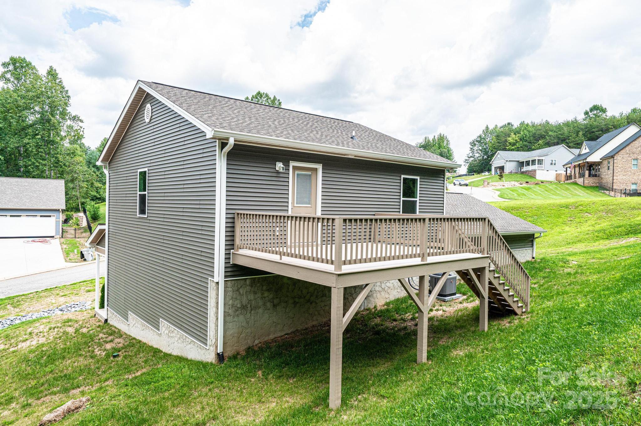 1214 Winter Place Lenoir, NC 28645 - Photo 4 of 19 a backyard of a house with table and chairs