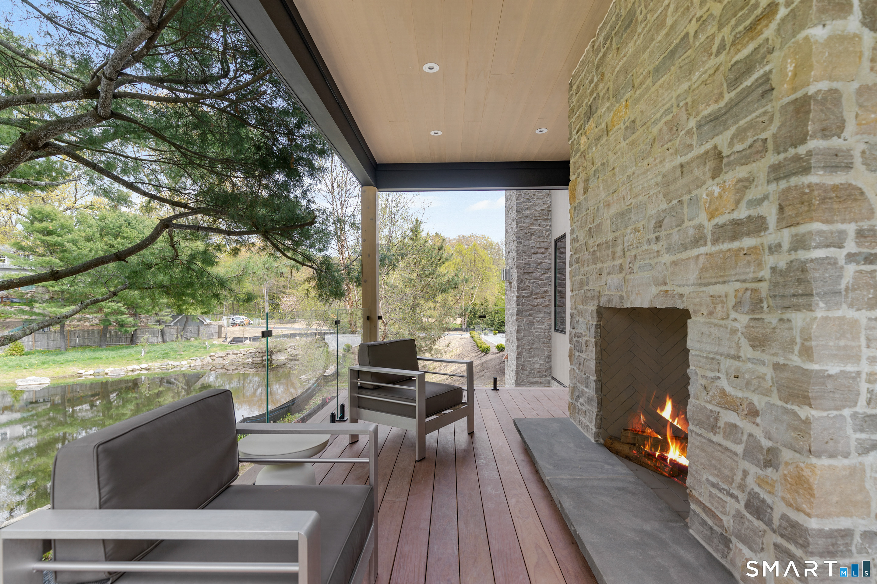 259 Frogtown Road New Canaan, CT 06840 - Photo 24 of 39 a living room with couches and a fireplace