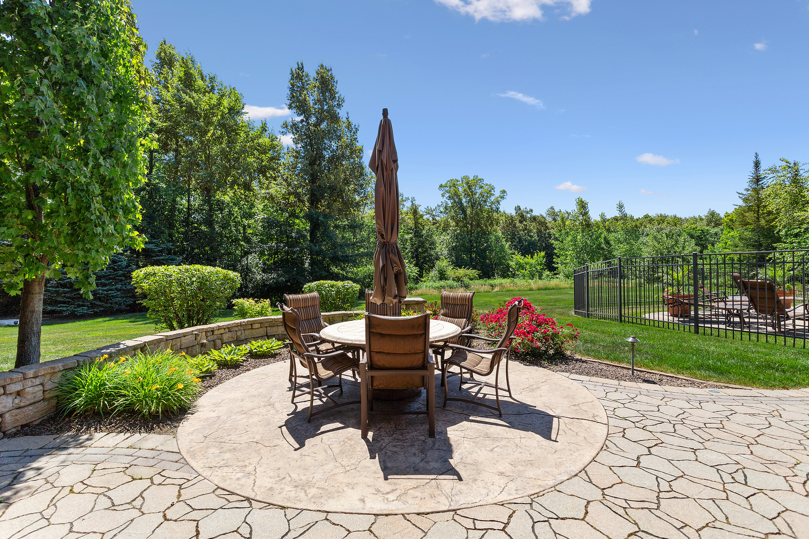 20133 Alison Trail Mokena, IL 60448 - Photo 12 of 42 a roof deck with table and chairs and a yard