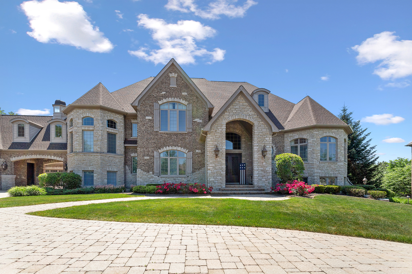 20133 Alison Trail Mokena, IL 60448 - Photo 5 of 42 a front view of a house with a yard and garage