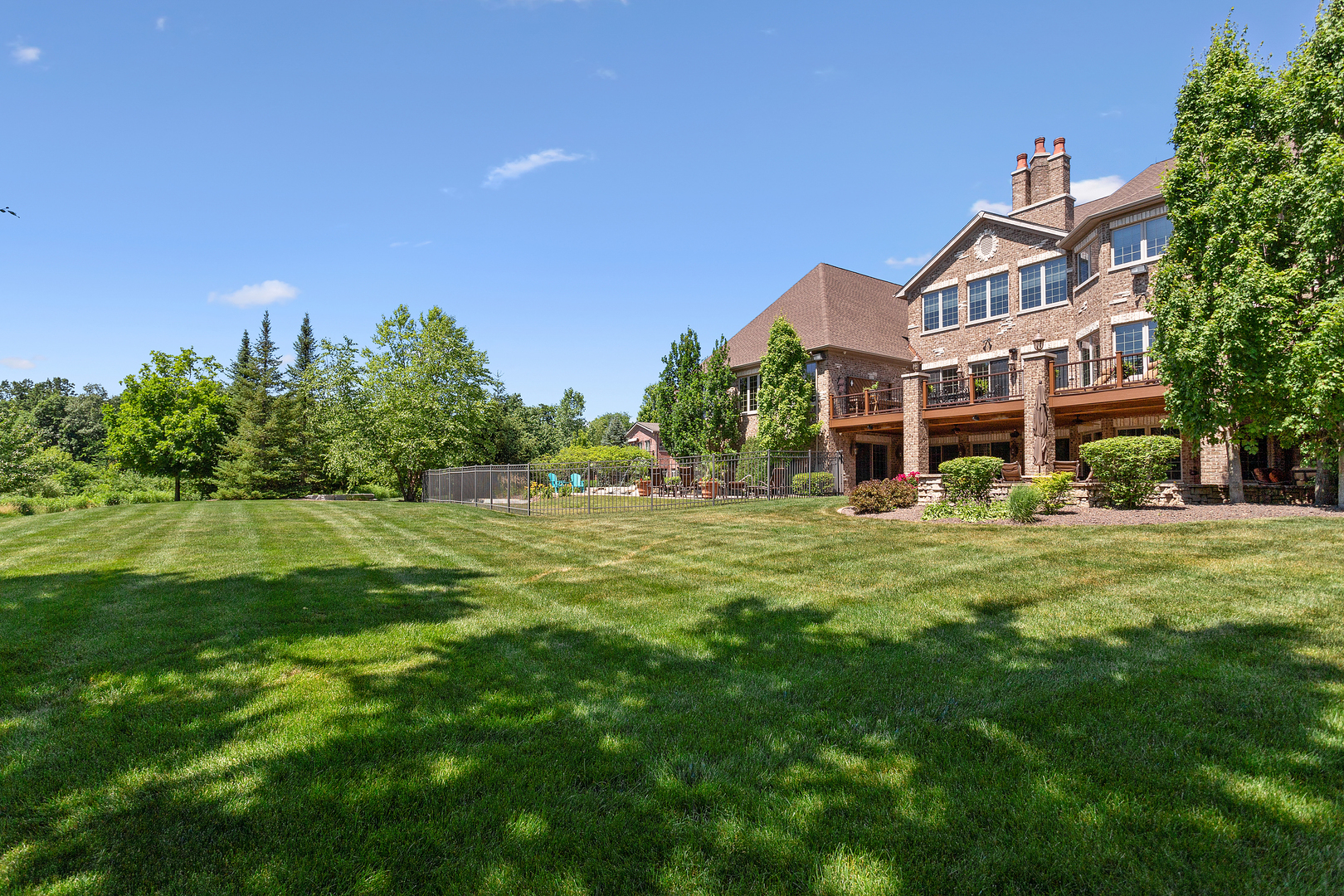 20133 Alison Trail Mokena, IL 60448 - Photo 10 of 42 a view of a big building with a big yard and large trees