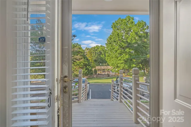 a view of a room that has a bed and a balcony