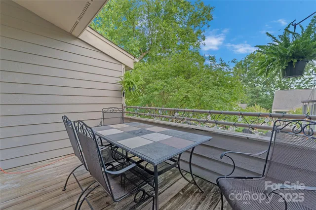 a view of a chairs and table on the deck