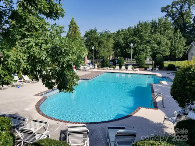 a view of a swimming pool with a patio