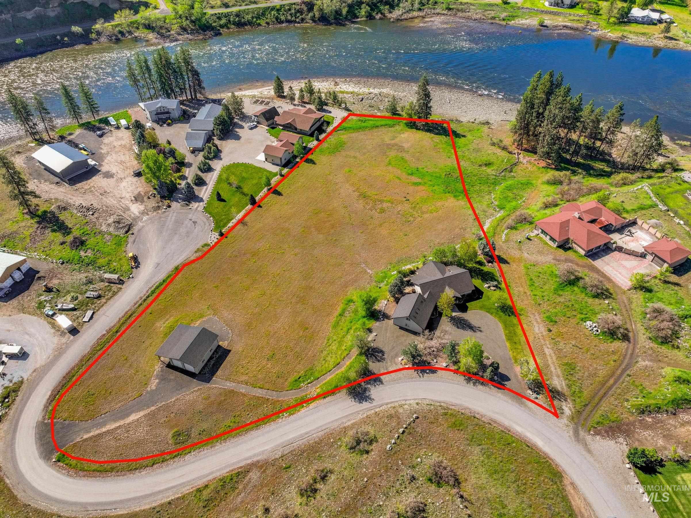 113 Deford Road White Bird, ID 83554 - Photo 2 of 49 Expansive riverfront property featuring a gently sloping topography and two distinct structures