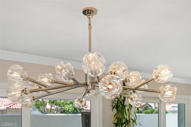 a kitchen with stainless steel appliances kitchen island granite countertop a refrigerator and a sink