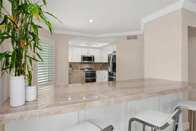 a spacious bathroom with a shower and a sink