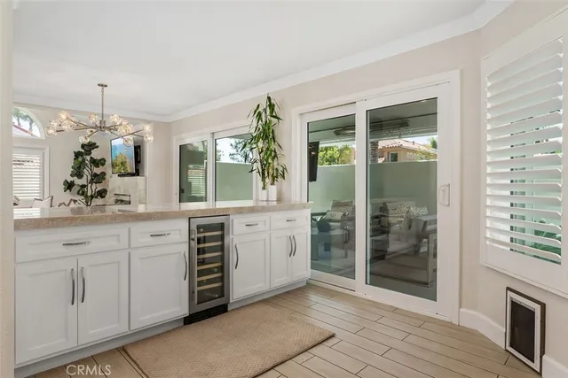 a kitchen with stainless steel appliances granite countertop a refrigerator stove and microwave