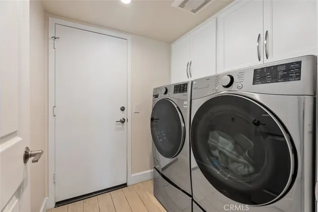 a bathroom with a granite countertop sink a mirror and vanity