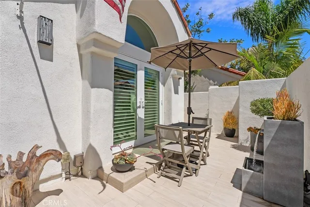 a room with a sink and a potted plant