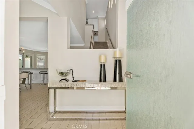 a living room with furniture dining table and a chandelier