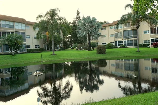 a view of a lake with a house in the background