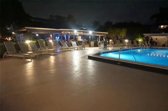 a view of a swimming pool with an outdoor space