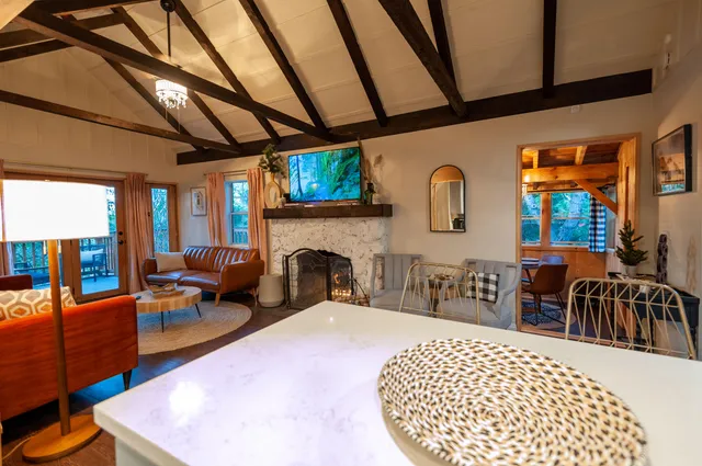 a very nice looking living room with a large window