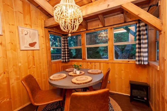a outdoor dining area with furniture and a window