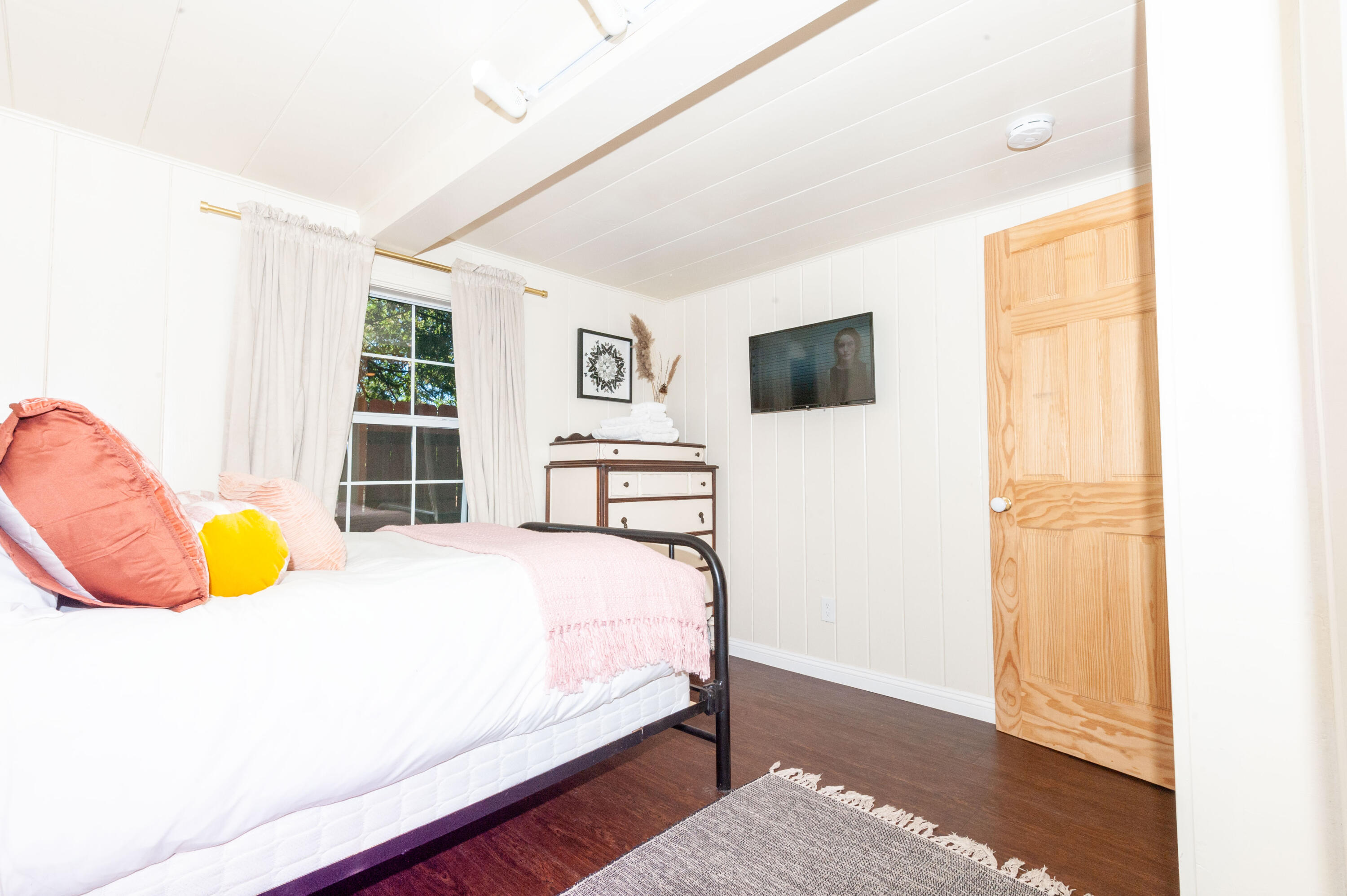 644 Cedar Lane Twin Peaks, CA 92391 - Photo 23 of 41 a bedroom with a bed and a flat screen tv